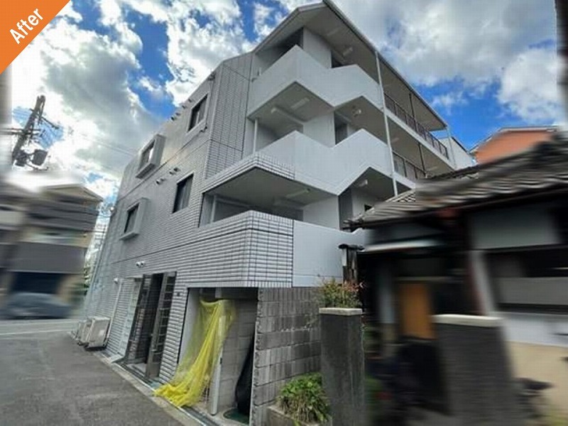 大阪市東住吉区の外壁塗装後のマンション側面（タイル）